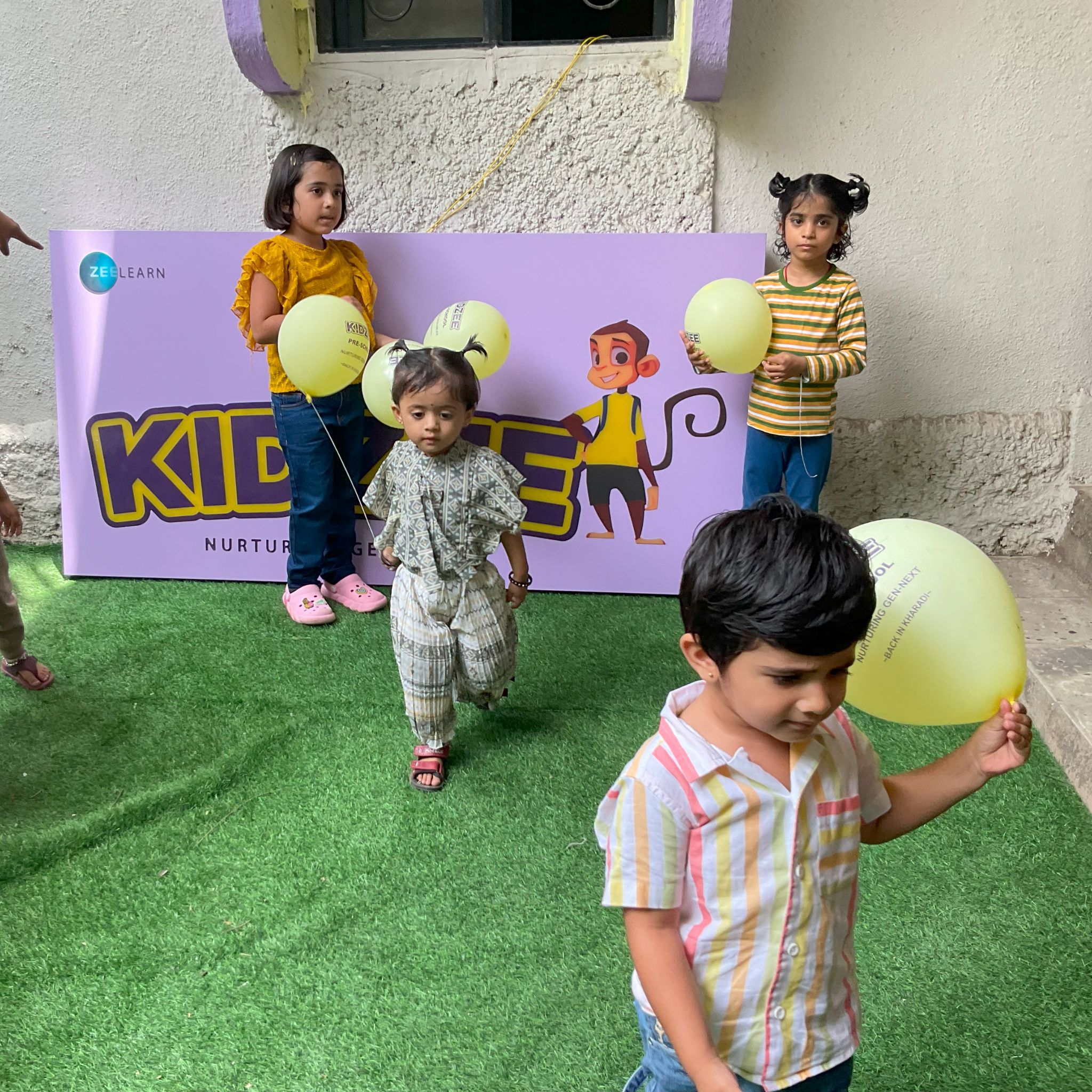 Children engaged in collaborative group play outdoors.
