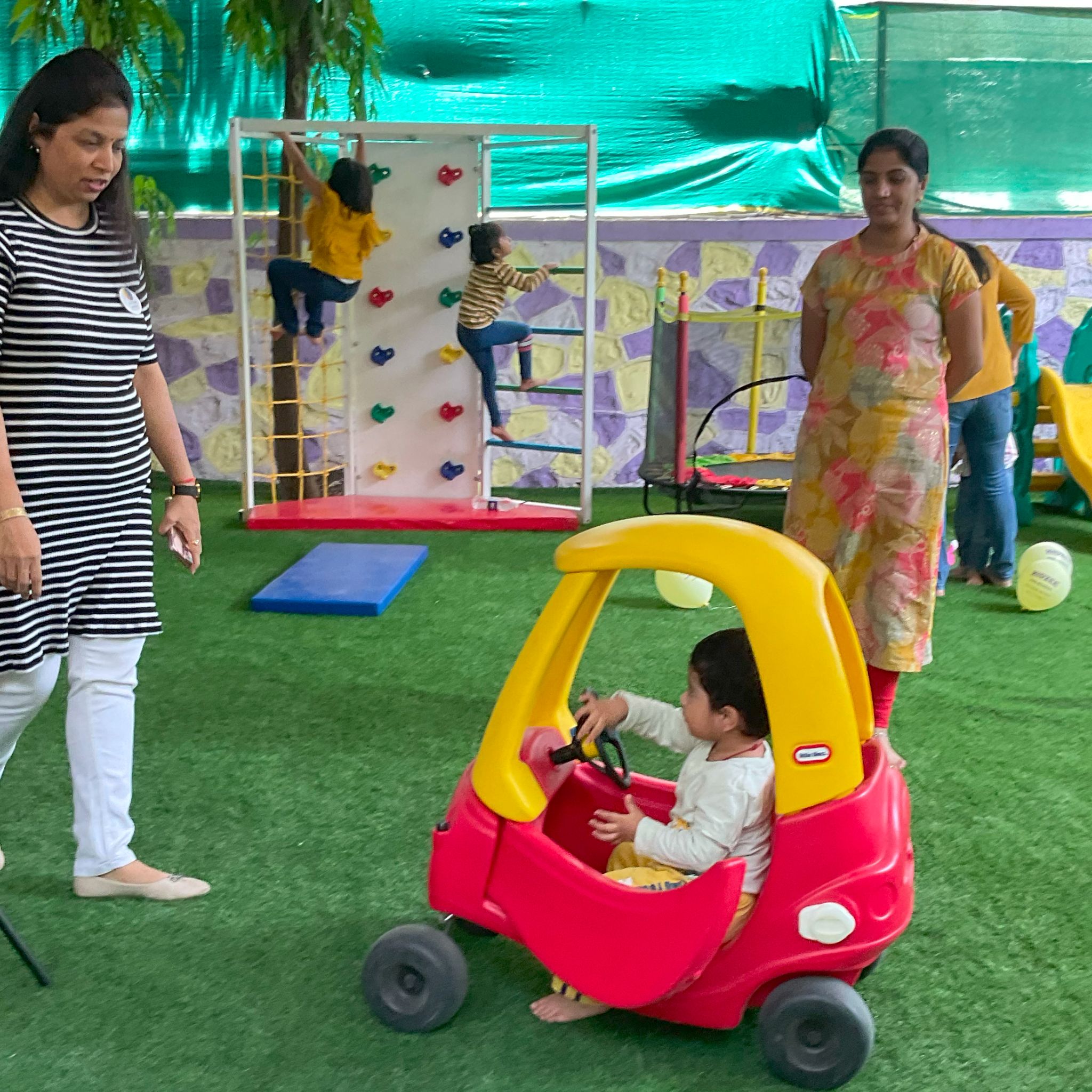 Safe and fun outdoor play area with swings and slides.
